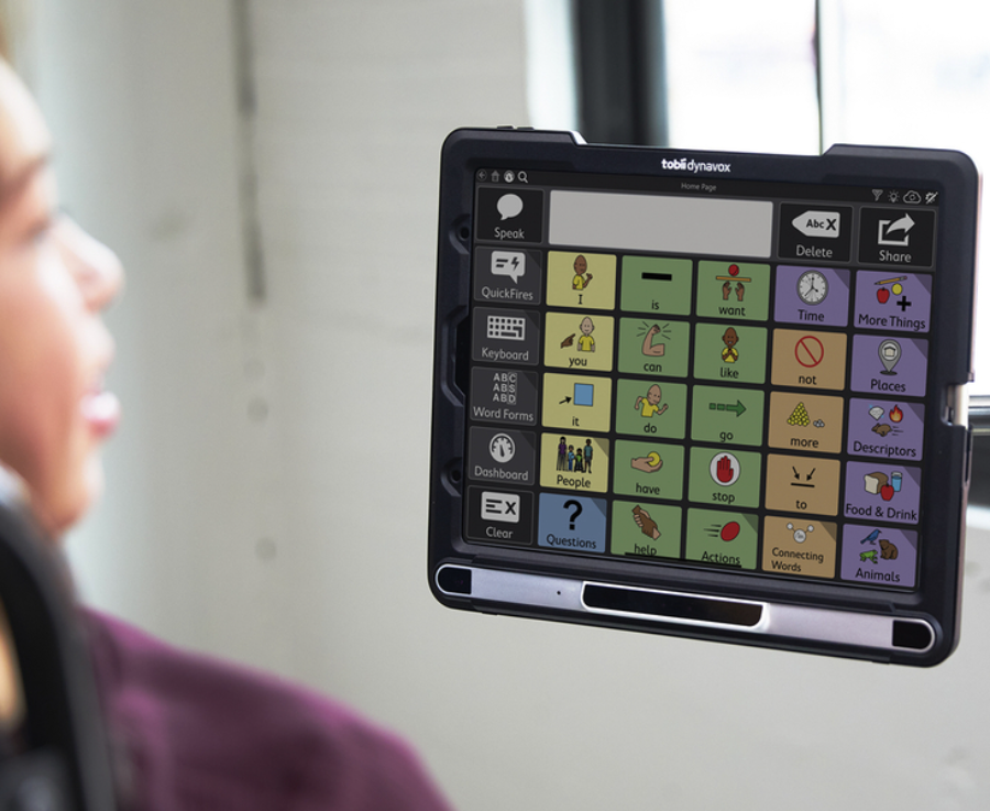 Young woman using TD Snap Motor Plan on a Tobii Dynavox communication device